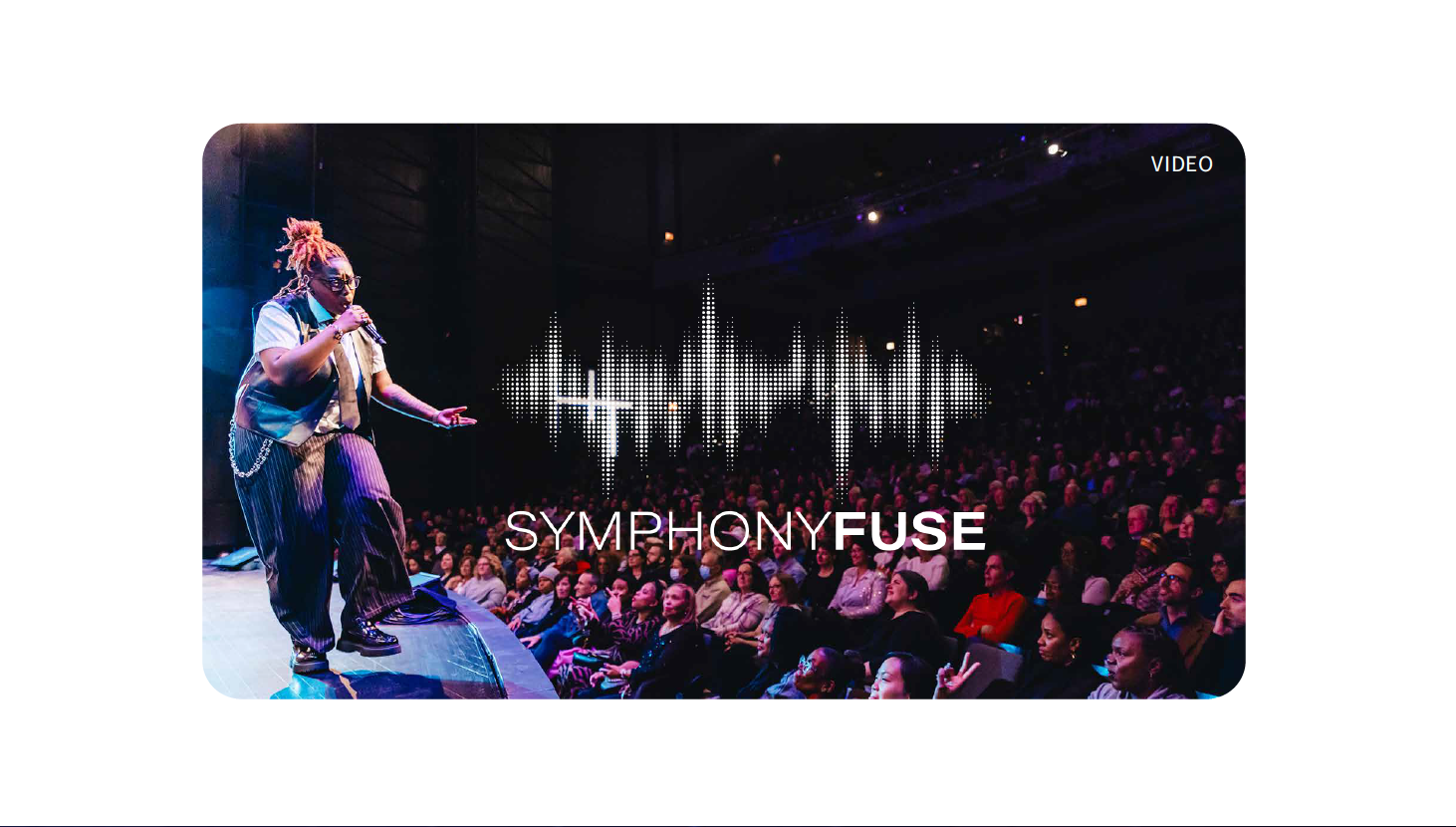 A SymphonyFuse conductor leads a live performance with full orchestra